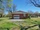 Detached brick garage with a single door and yard at 112 W Highway 218 Rd, Monroe, NC 28110