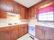 Kitchen features wood cabinets and a window at 112 W Highway 218 Rd, Monroe, NC 28110