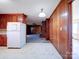 Kitchen area with wood cabinets and view into living room at 112 W Highway 218 Rd, Monroe, NC 28110