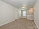 Spacious loft area with carpet and two closets at 512 Kingsway Cir, Charlotte, NC 28214