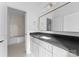 Bathroom boasting a dark countertop and a stylish mirror at 19413 Coachmans Trce, Cornelius, NC 28031