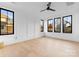 Spacious bedroom featuring hardwood floors and multiple windows at 19413 Coachmans Trce, Cornelius, NC 28031