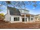 Modern farmhouse exterior with covered patio at 19413 Coachmans Trce, Cornelius, NC 28031