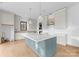 Modern kitchen with large island and light-colored cabinetry at 19413 Coachmans Trce, Cornelius, NC 28031