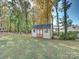 Yard with a charming storage shed and fall leaves at 111 Bobby Lee Ln # 18, Mooresville, NC 28115
