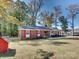 Brick ranch house with red shutters and a yard at 111 Bobby Lee Ln # 18, Mooresville, NC 28115