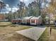 Brick ranch house with red shutters and a yard at 111 Bobby Lee Ln # 18, Mooresville, NC 28115