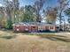 Brick ranch house with red shutters and a yard at 111 Bobby Lee Ln # 18, Mooresville, NC 28115