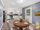 Kitchen features white cabinets, granite countertops, and stainless steel appliances at 111 Bobby Lee Ln # 18, Mooresville, NC 28115
