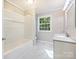 Clean bathroom with a bathtub, shower, and vanity at 111 Bobby Lee Ln # 18, Mooresville, NC 28115