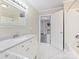 Bathroom with white vanity, marble floors, and access to bedroom at 111 Bobby Lee Ln # 18, Mooresville, NC 28115