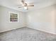 Simple bedroom with gray carpet and a window at 111 Bobby Lee Ln # 18, Mooresville, NC 28115