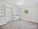 Cozy bedroom featuring built-in shelving and a window at 111 Bobby Lee Ln # 18, Mooresville, NC 28115