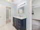 Modern bathroom with marble floors and a dark vanity at 111 Bobby Lee Ln # 18, Mooresville, NC 28115