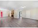 Spacious living room featuring a brick fireplace and gray vinyl plank flooring at 111 Bobby Lee Ln # 18, Mooresville, NC 28115