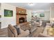 Living room with fireplace, staged furniture, and hardwood floors at 111 Bobby Lee Ln # 18, Mooresville, NC 28115