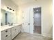 Bathroom with single vanity and walk-in closet at 3860 Nc Hwy 200 Hwy, Concord, NC 28025
