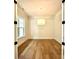 Light-filled office space with hardwood floors and a large window at 3860 Nc Hwy 200 Hwy, Concord, NC 28025
