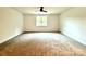Spacious bedroom with neutral carpeting and large window at 3860 Nc Hwy 200 Hwy, Concord, NC 28025
