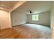 Bright bedroom featuring neutral carpeting and ceiling fan at 3860 Nc Hwy 200 Hwy, Concord, NC 28025