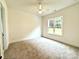 Bright bedroom with carpet and large window at 3860 Nc Hwy 200 Hwy, Concord, NC 28025