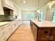 Open concept kitchen with stainless steel appliances and large island at 3860 Nc Hwy 200 Hwy, Concord, NC 28025