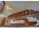 Elegant spiral staircase viewed from above, showcasing rich wood tones at 2929 Laura Rd, Shelby, NC 28150