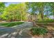 Stunning two-story house with a stone driveway, nestled among lush green trees at 2929 Laura Rd, Shelby, NC 28150