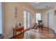 A sunlit hallway with French doors and hardwood floors at 2929 Laura Rd, Shelby, NC 28150