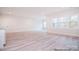 Spacious basement with large windows, hardwood floors, and an open layout at 106 Windbluff Ct # 163, Statesville, NC 28677
