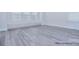 Spacious bedroom with built-in storage and wood-look flooring at 106 Windbluff Ct # 163, Statesville, NC 28677