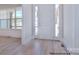 Bright entryway with hardwood floors and a view into the living room at 106 Windbluff Ct # 163, Statesville, NC 28677