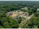 Aerial view of a new luxury home community with large homes and green spaces at 8022 Litaker Manor Ct, Charlotte, NC 28270