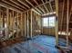 Image shows a spacious room under construction with large windows and high ceilings at 1969 Maryland Ave, Charlotte, NC 28209