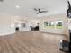 Open concept kitchen with white cabinets, stainless steel appliances, and island at 1005 Piper Meadows Dr # 1, Waxhaw, NC 28173