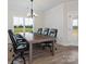Formal dining room with large table and leather chairs at 1005 Piper Meadows Dr # 1, Waxhaw, NC 28173