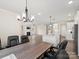Dining area with large table and chairs, open to kitchen and living room at 1005 Piper Meadows Dr # 1, Waxhaw, NC 28173