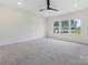 Bright bedroom featuring neutral carpeting and large window at 1005 Piper Meadows Dr # 1, Waxhaw, NC 28173