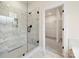 Shower with glass enclosure and marble tile, leading to a walk-in closet at 1005 Piper Meadows Dr # 1, Waxhaw, NC 28173