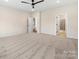 Spacious bedroom with neutral carpeting and access to bathroom and closet at 1005 Piper Meadows Dr # 1, Waxhaw, NC 28173