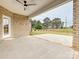 Covered back patio with brick and concrete flooring, offering a relaxing outdoor space at 1005 Piper Meadows Dr # 1, Waxhaw, NC 28173