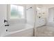 Bathroom with soaking tub, marble accents and vanity at 1005 Piper Meadows Dr # 1, Waxhaw, NC 28173