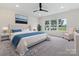 Main bedroom with plush carpet, large window and sitting area at 1005 Piper Meadows Dr # 1, Waxhaw, NC 28173
