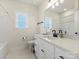 Clean bathroom with white vanity, bathtub, and black fixtures at 1005 Piper Meadows Dr # 1, Waxhaw, NC 28173