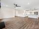 Open concept kitchen with white cabinets and island, overlooking living room at 1005 Piper Meadows Dr # 1, Waxhaw, NC 28173