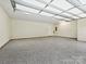 Large garage with epoxy flooring and extra storage at 1005 Piper Meadows Dr # 1, Waxhaw, NC 28173