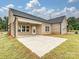 Tan brick home with covered patio and large backyard at 1005 Piper Meadows Dr # 1, Waxhaw, NC 28173