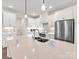 Modern kitchen with white cabinets, large island, and stainless steel appliances at 1005 Piper Meadows Dr # 1, Waxhaw, NC 28173