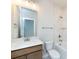 Modern bathroom with wood vanity, white toilet and bathtub at 113 Ryan Ln, Mooresville, NC 28115