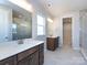 Bathroom boasting a double vanity, walk-in shower, and ample closet space at 113 Ryan Ln, Mooresville, NC 28115